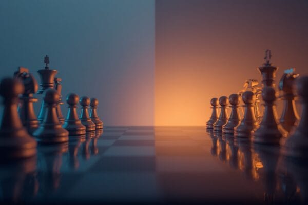 Jobs that will survive AI automation 2026 concept showing wooden chess pieces standing firm against robotic pieces, symbolizing human roles that remain resilient as AI advances